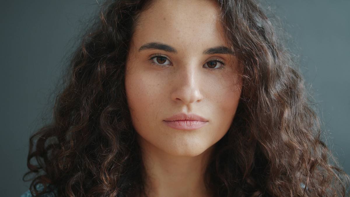 Woman with flawless spiral perm showcasing perm hair inspiration